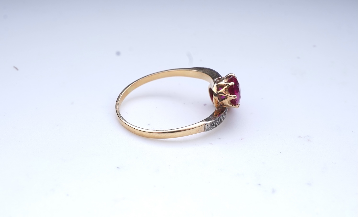A synthetic ruby and diamond 'toi-et-moi' ring, early 20th century